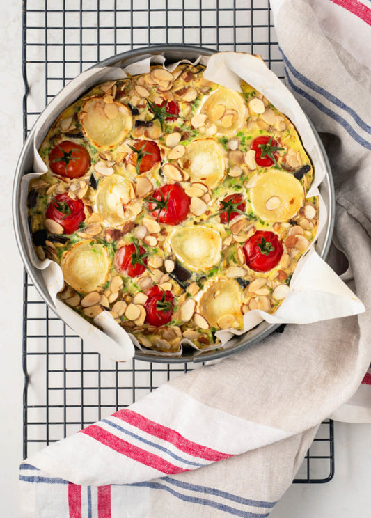 A twist on a classic French dessert, this easy and elegant savory clafoutis colorfully highlights summer vegetables