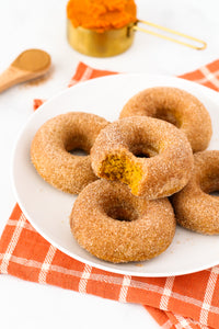 Fluffy baked pumpkin donuts, coated in cinnamon sugar