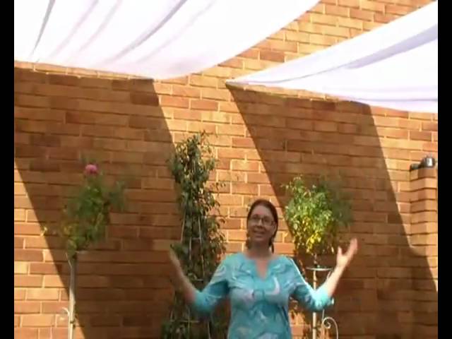Watch this easy and affordable way to make a romantic shade canopy to cover your veranda